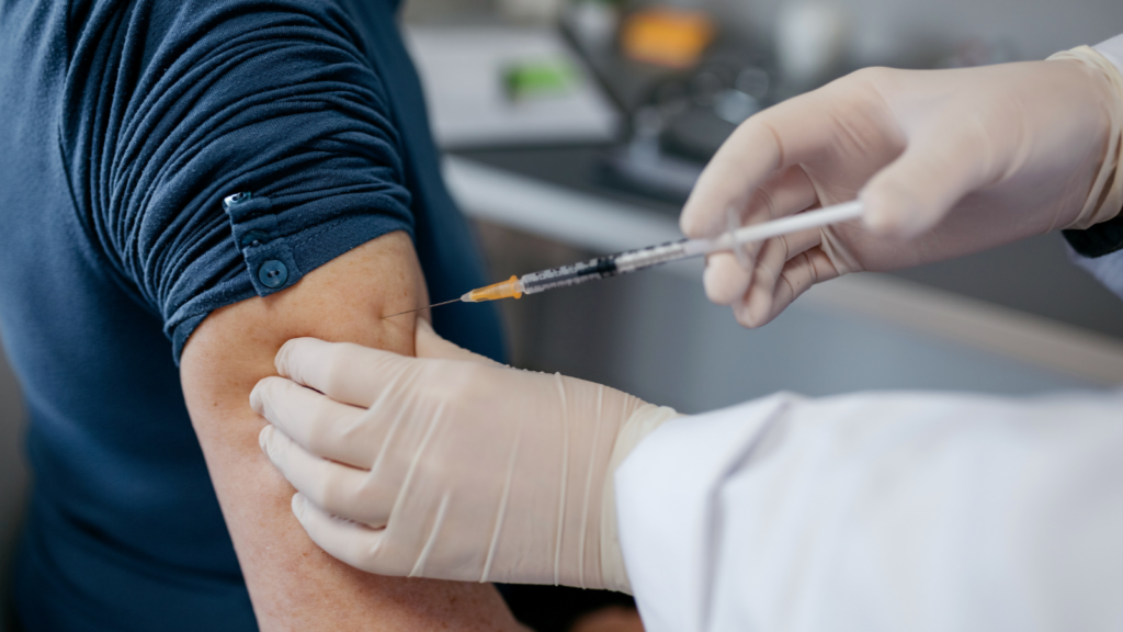 Stock image of someone receiving a vaccine